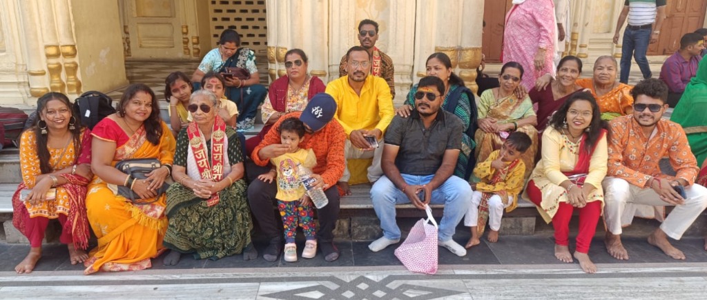 A group of pilgrims next to their luxury private coach.