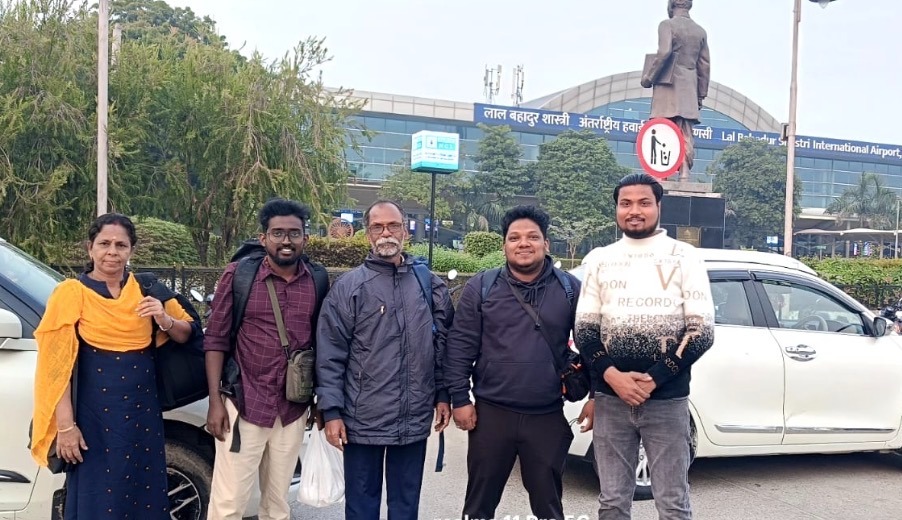 Family standing together at Lal Bahadur Shastri Airport, Babatpur.