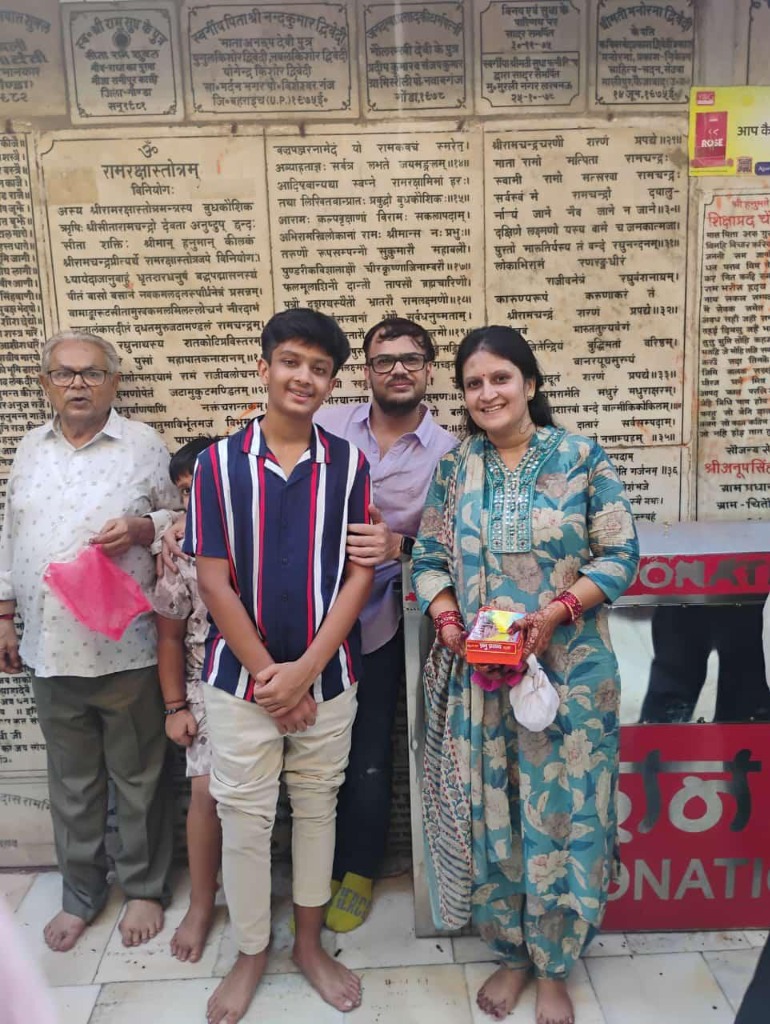 Family taking a selfie after arriving at Ayodhya Airport D1.